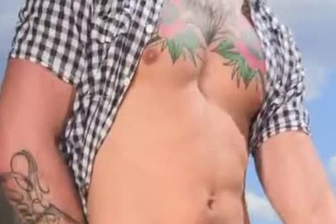 tasty Tattooed Hunk bang In The Farm - large