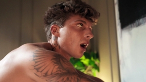 Spreading passion in bed with tattooed top
