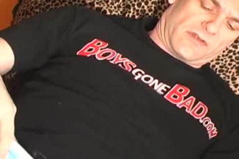 daddy lays on the floor and uses a sextoy